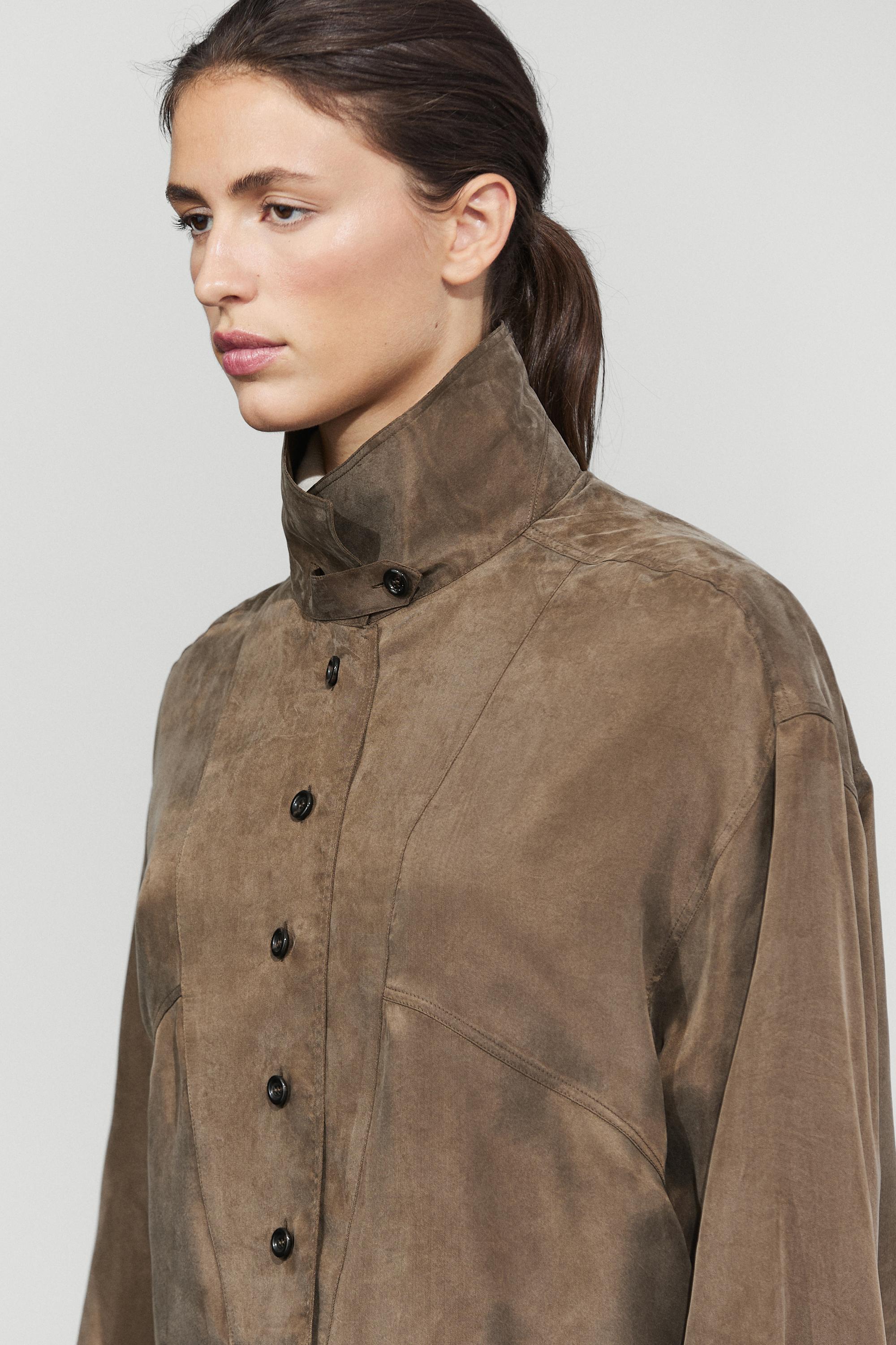 Flowing shirt with stand collar and bib detail